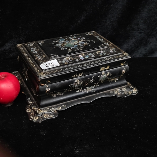 238 - A gorgeous lacquer and mother of pearl inlaid jewellery box. Brass hinge needs some attention but ot... 