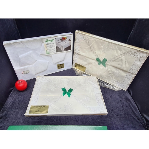 272 - Three boxed and unopened Irish linen sets including two ' Prospect' eight piece luncheon sets compri... 