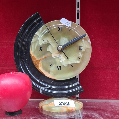 292 - A very handsome art deco style onyx battery operated desk clock.