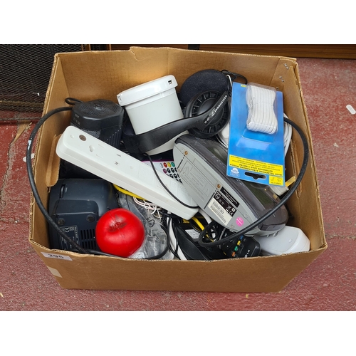 295 - A box containing various electronic items and accessories: a Philips digital clock, a Macally USB ch... 