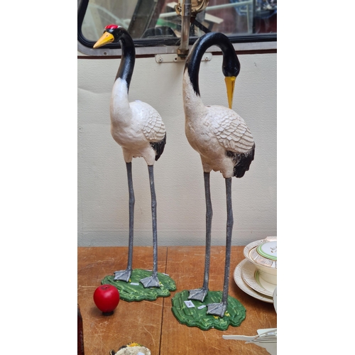 314 - Star lot : Two heavy tall cast metal garden ornaments in the form of two red crowned cranes. Fabulou... 