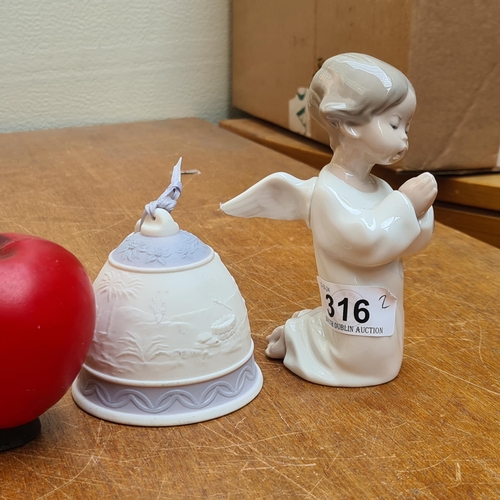 316 - Two Lladro porcelain items. Including Angel Praying figurine and a Bell. Both stamped to base. In ve... 