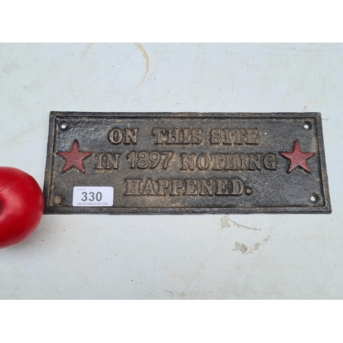 330 - A Cast metal plaque with inscription 'On this site in 1897 Nothing Happened'.