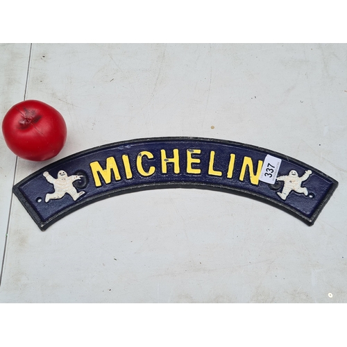 337 - A heavy cast metal Michelin sign. Hand-painted in a dark navy blue with a pale yellow text.