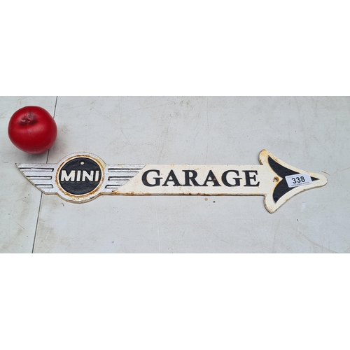 338 - A heavy cast metal finger pointer sign for Mini Garage.