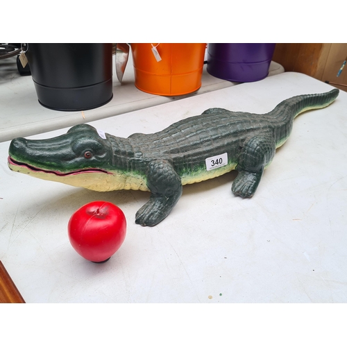 340 - A good size very heavy cast iron crocodile figure with a realistic textured finish.