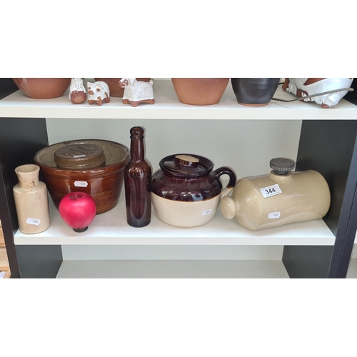 344 - Five stoneware items including a wonderful Pearson's Chesterfield hot water bottle and an American m... 