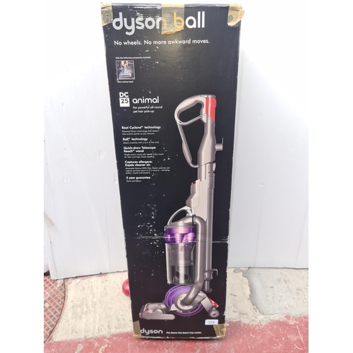 354 - An as new boxed, Dyson ball DC25 animal upright vacuum cleaner / hoover. With all attachments. RRP €... 