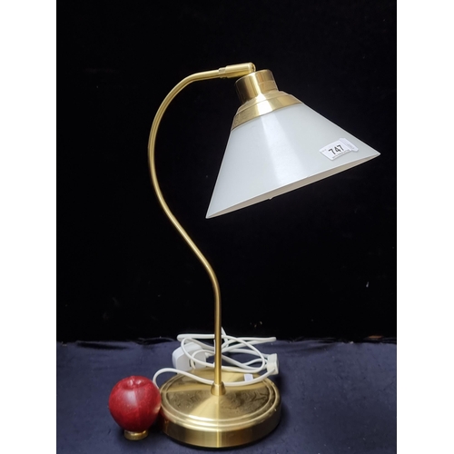 373 - An IKEA brass table lamp with adjustable white shade. Classic design with modern appeal.