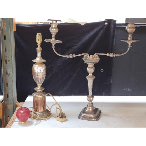 376 - Two tall silver plate items including a table lamp and a two light candelabra, centre piece removed.