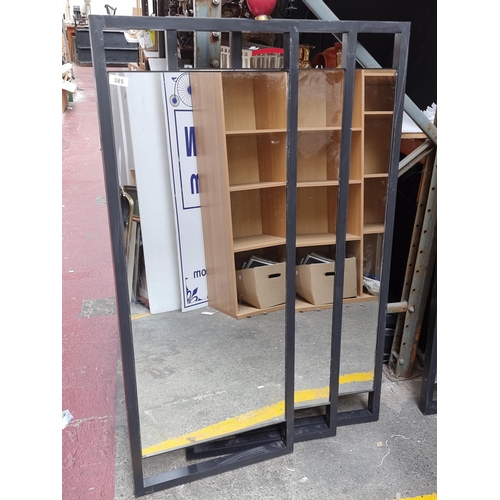 385 - Three large commercial style wall hanging mirrors. All featuring heavy metal frames and fittings to ... 