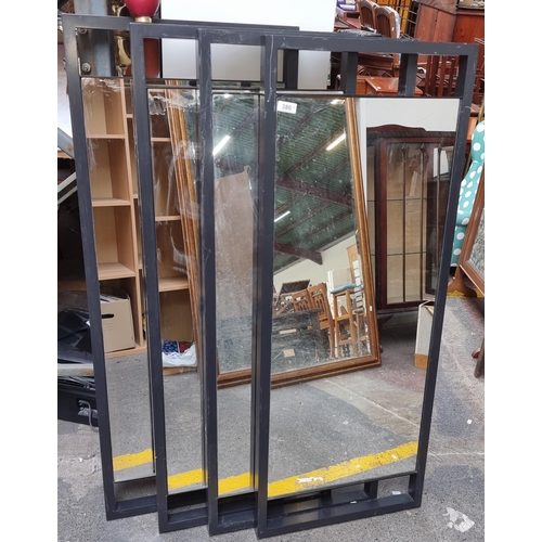 386 - Four large commercial style wall hanging mirrors. All featuring heavy metal frames and fittings to r... 