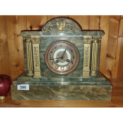 390 - An impressive antique green marble mantel clock with brass toned columns and pillars. Great weight t... 