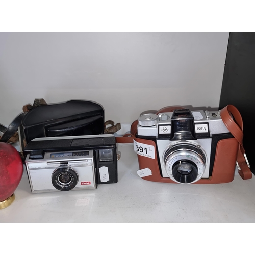 391 - Two  vintage cameras including a Kodak Reomar as well as a Agfa Isoly Achromat. Both come complete w... 