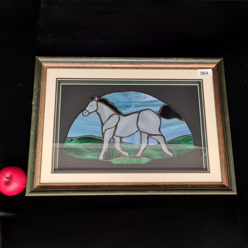 64 - A fabulous framed stained glass artwork featuring a galloping horse. Housed in a shadow box frame be... 