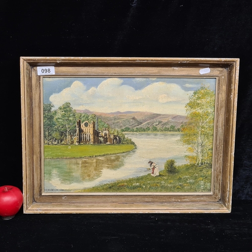 98 - A charming original oil on board painting featuring an Abbey ruin, river and female figure. Signed '... 