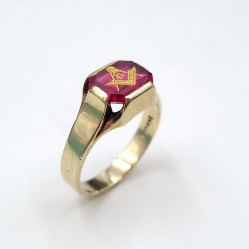 576 - Star Lot : A very attractive Masonic gem set ring set in 14 carat gold marked to band. Ring size - V... 