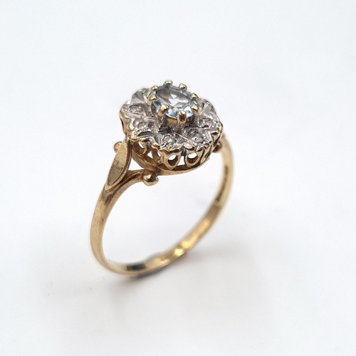 582 - Star Lot : A diamond and aquamarine stone cluster ring set in nine carat gold. Size - L. Weight - 1.... 