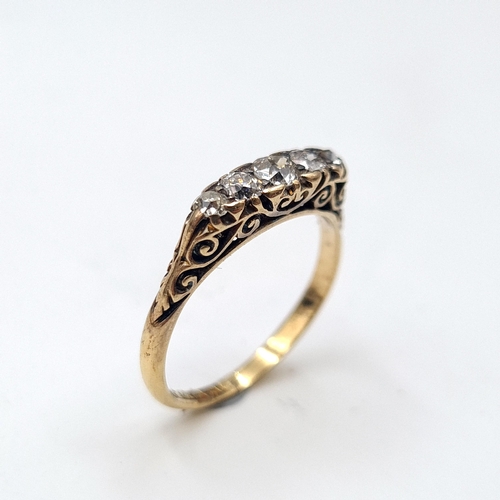 586 - Star Lot : A pretty vintage five stone diamond ring set in 18 carat gold. Est. weight of diamonds is... 