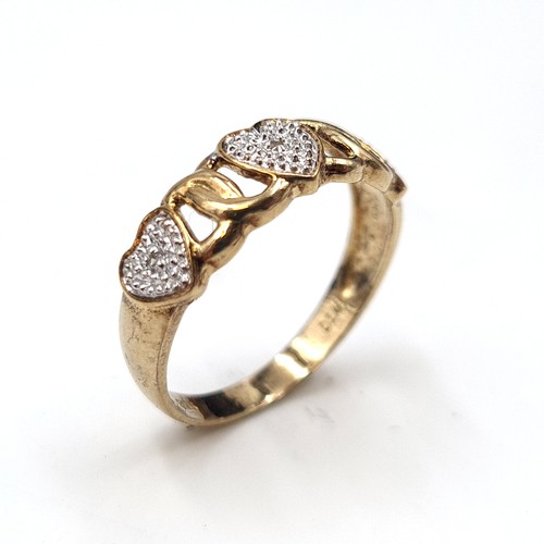 591 - Star Lot : A diamond heart shaped ring with diamond stamped to band set in nine carat gold. Ring siz... 