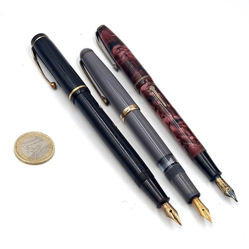 592 - A collection of three pens - A Swan example with 14 carat gold nib together with a Mont Blanc pen wi... 