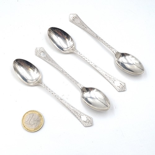 597 - Four vintage sterling silver teaspoons with bright cut handles hallmarked Sheffield. Weight - 41 gra... 