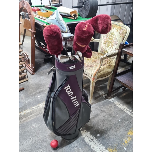 643 - A set of golf clubs including MacGregor irons and wedges, driver, 3 and 5 wood. Along with a Spaldin... 