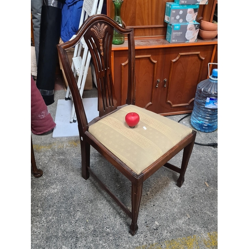 644 - A fine mahogany chair with sheaf of wheat carving to back and padded upholstered seat.