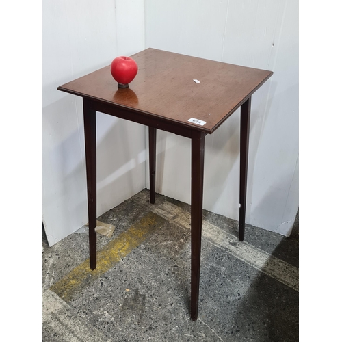 654 - A super elegant early 20th century tapered leg side table with string inlay to top.