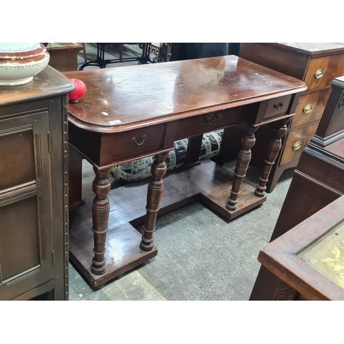 656 - Star Lot : An early 20th century turned leg console hall table. Three baize lined drawers to front. ... 