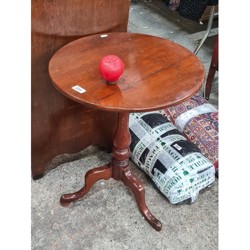 659 - An early 20th century tilt top side drinks table with tripod base.