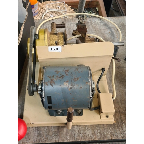 670 - A vintage AG E key cutter machine. PN 1901. HP 1/6 V 220.