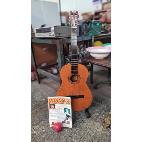 678 - A Alhambra 1C HT Classical six string Guitar. Manufactured by Alhambra S.L. Along with a Guitar stan... 