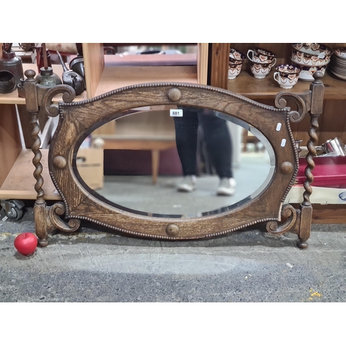 681 - A wonderful wooden wall hanging beveled glass mirror. With an elaborate barley twist and beaded deta... 