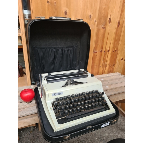 687 - An excellent 1980s Erika branded typrewriter complete in its original hard shell travel case. In sup... 