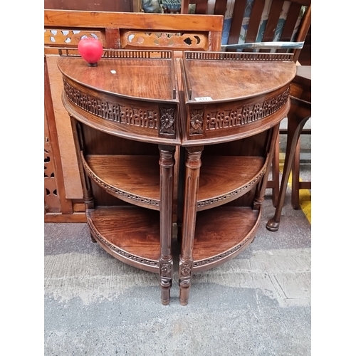 417 - Star Lot : A fabulous Pair of Edwardian mahogany demilune side tables, ornately carved with floral m... 