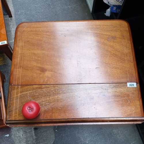 420 - Star lot : A handsome golden mahogany antique  drop-leaf table with inlaid detailing. Features two f... 