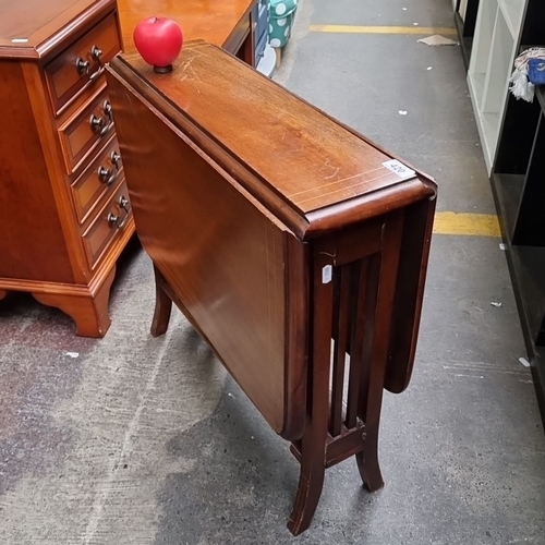 420 - Star lot : A handsome golden mahogany antique  drop-leaf table with inlaid detailing. Features two f... 