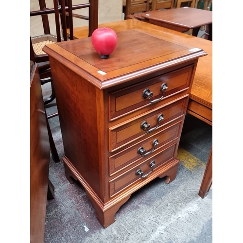 421 - Four-drawer nightstand in polished mahogany, featuring metal handles and dovetail joinery. From the ... 