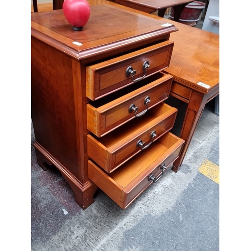 421 - Four-drawer nightstand in polished mahogany, featuring metal handles and dovetail joinery. From the ... 