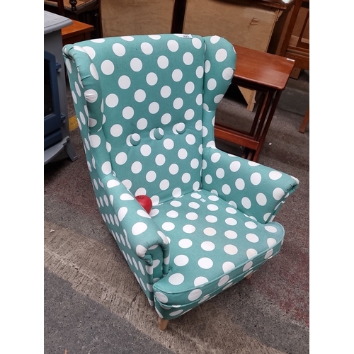 425 - Star lot : A lovely mid century Polka dot upholstered wingback armchair in teal and white, with wood... 