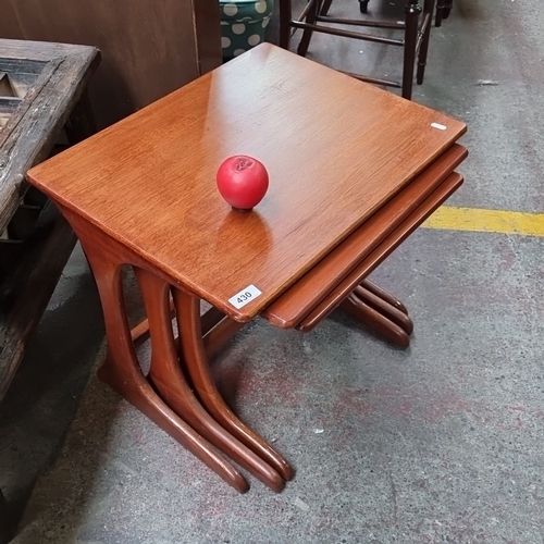 430 - Star Lot : A fabulous set of Mid-Century Modern teak nesting tables with sculpted bases. Includes th... 