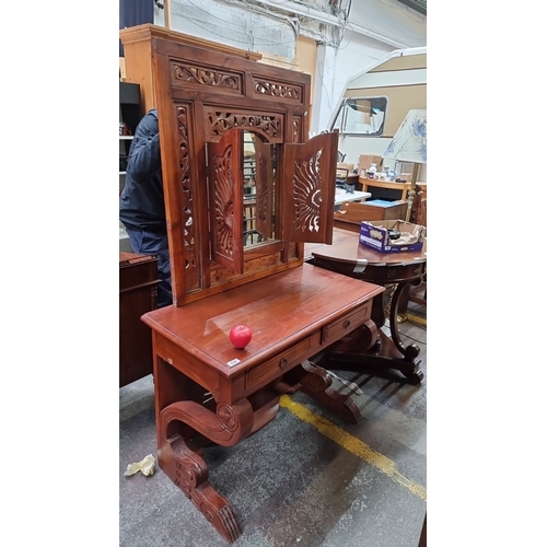 434 - Star Lot : A very handsome red mahogany  vanity or console table with detailed carved mirror behind ...