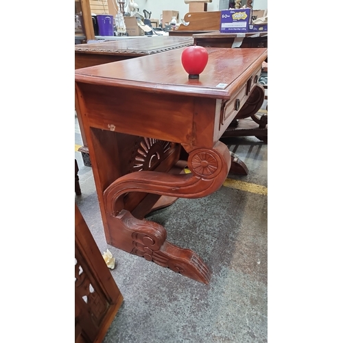 434 - Star Lot : A very handsome red mahogany  vanity or console table with detailed carved mirror behind ... 