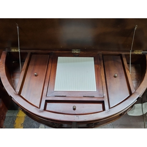 436 - Star Lot : A brilliant Victorian mahogany console features a lift-top compartment, ornate carvings, ... 