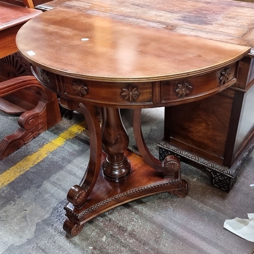 436 - Star Lot : A brilliant Victorian mahogany console features a lift-top compartment, ornate carvings, ... 