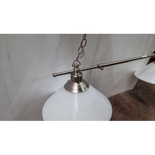 439 - Modern three-light pendant fixture with milk  glass shades and brushed metal finish.