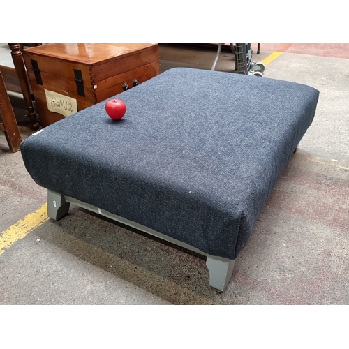 440 - A lovely large Blue fabric ottoman with grey legs.