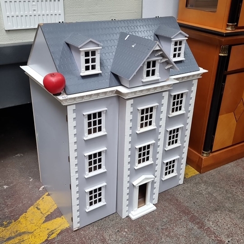 441 - A large wooden dollhouse, gray exterior with architectural details, hinged front opens to reveal thr... 