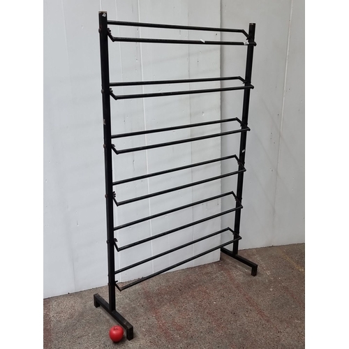 444 - Vintage metal retail display rack with six adjustable horizontal bars.